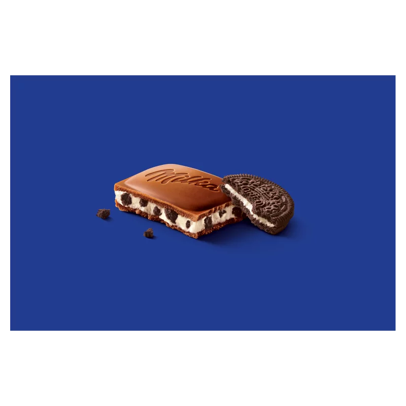 Milka Oreo alpesi tejcsokoládé kakaós kekszdarabokkal és vaníliaízű tejes krémtöltelékkel 100 g